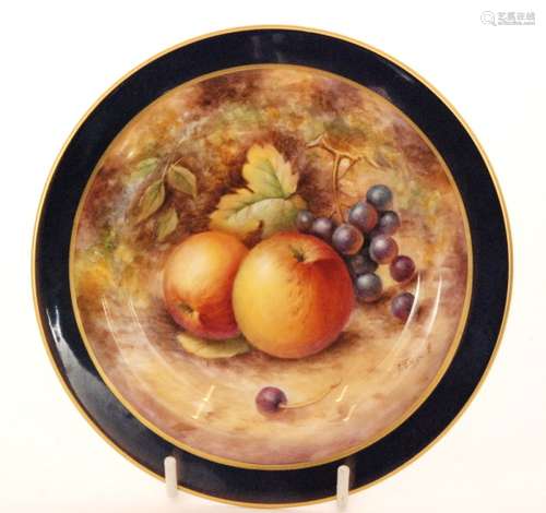 A small Royal Worcester Fallen Fruits cabinet plate decorated by P. English with hand painted apples and black grapes within a blue border