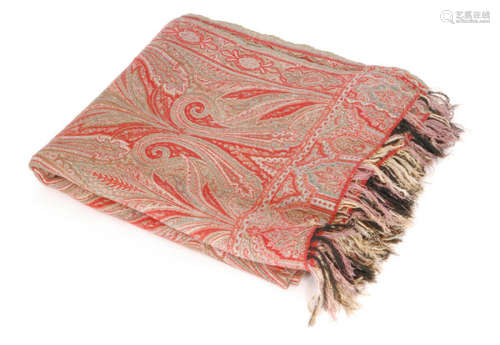 A large late 19th Century Paisley shawl mainly in red and green with long running repeat boteh motif and a fringed edge