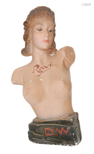 A 1940s/1950s shop window advertising plaster of Paris counter top bust for Revi Bras modelled as a nude lady with Ravi across her bust and initialled D.W to the stepped base