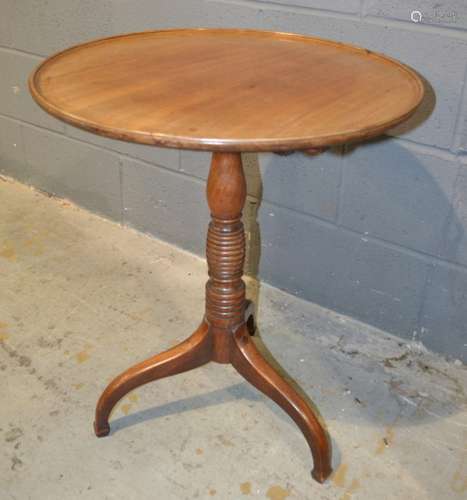 A Georgian and later mahogany snap top supper table of dished circular form