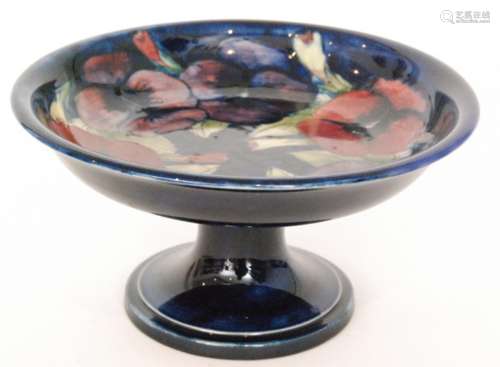 A 1930s William Moorcroft pedestal comport decorated in the Pansy pattern