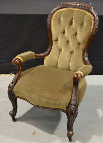 A Victorian carved walnut easy chair