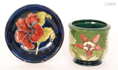 Two pieces of Moorcroft comprising a jardiniere decorated in the Columbine pattern