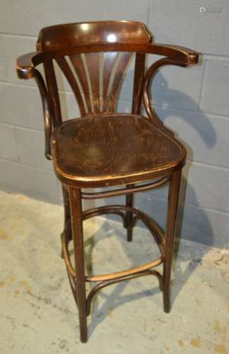 A 1920s stained beech bentwood high back elbow chair