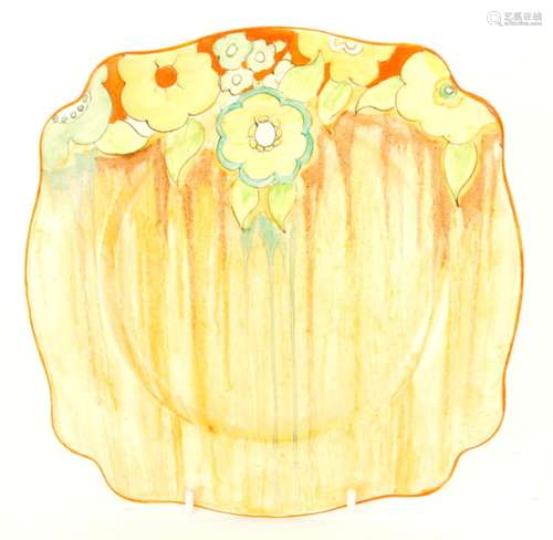 A Clarice Cliff Jonquil pattern Leda shaped plate circa 1934 hand painted with a band of stylised flowers and foliage over a tonal brown Delecia streaked ground