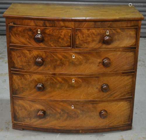 A 19th Century bow fronted chest of two short over three long drawers