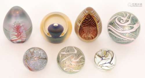 A group of Okra studio glass paperweights comprising a limited edition paperweight titled Floating Pcarlo