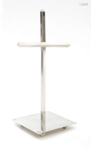 A hallmarked silver ring tree modelled as a cross set to a square base