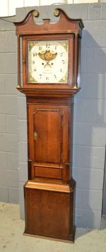 A 19th Century oak and mahogany crossbanded longcase clock by John Latham Macclesfield with eight day striking and moon phase enclosed by a glazed hood above a short trunk door on canted plinth base