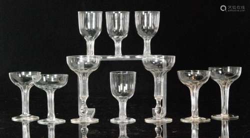 A group of late 19th Century hollow stem Champagne glasses comprising a set of four with slender stems and wide bowls