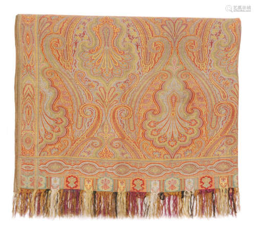 A large 19th Century Paisley shawl loom woven with a repeat pattern with a patterned border edge and a tasselled fringe