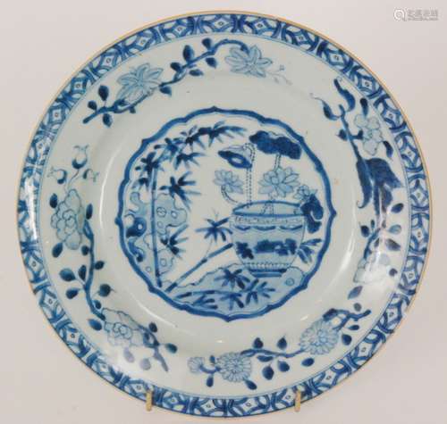 A 19th Century Chinese shallow plate decorated with a central roundel with a vase of flowers and bamboo shoots