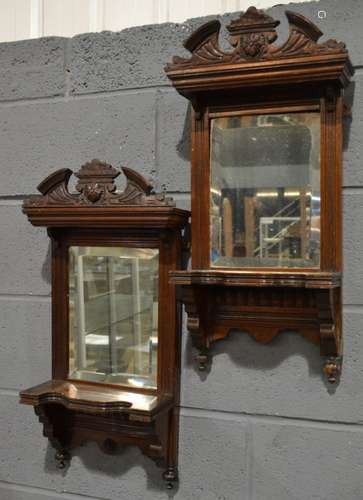 A pair of early 20th Century mahogany framed bevelled edged rectangular wall mirrors