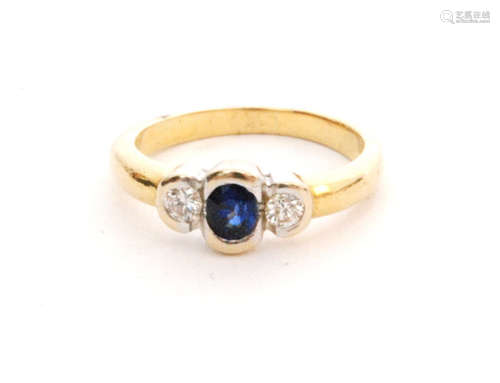 A modern 18ct sapphire and diamond three stone