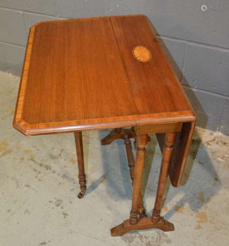 An Edwardian satinwood crossbanded mahogany Sutherland table