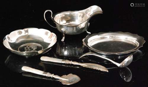 Five items of assorted hallmarked silver to include a sauce boat