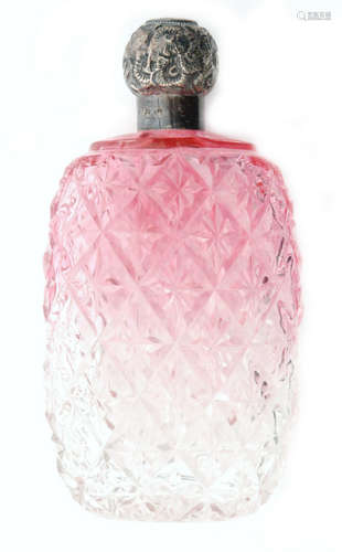 A hallmarked silver topped glass scent bottle