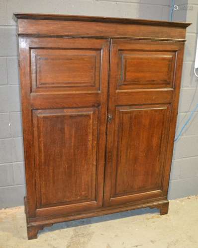 A George III oak and mahogany crossbanded cupboard