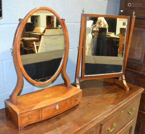 A 19th Century mahogany toilet swing mirror of oval form