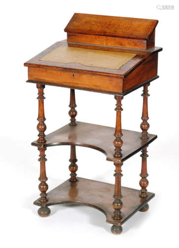 A Victorian three tier marquetry inlaid writing desk