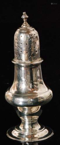 A George III hallmarked silver caster of baluster form with engraved lion crest pierced pull off cover and urn shaped finial