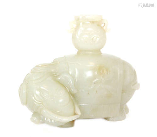 A Chinese celadon jade water vessel carved in the shape of an elephant with head bowed and turned to the left