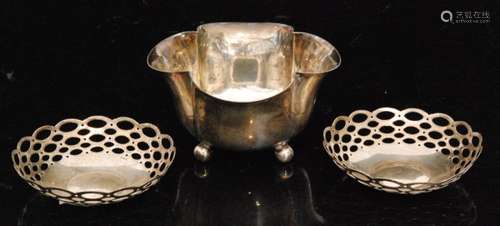 A hallmarked silver petal shaped sugar basin raised on three ball feet