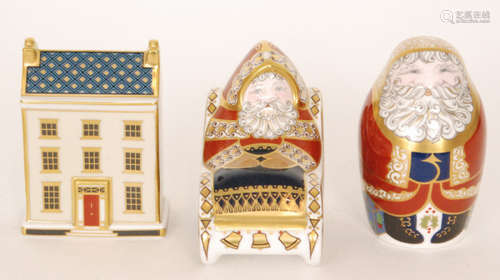 Three assorted Royal Crown Derby paperweights comprising a standing Santa Claus