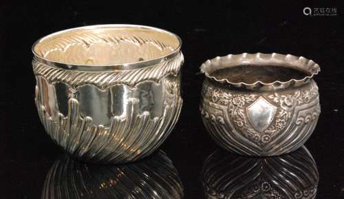 A Victorian hallmarked silver circular bowl with part fluted decoration and embossed border decoration