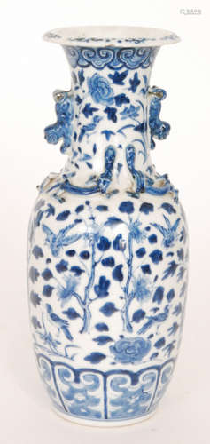 A late 19th Century Chinese blue and white vase decorated with flowers and birds