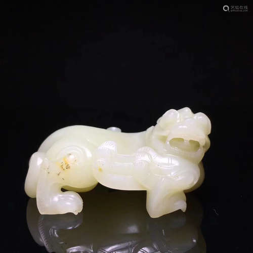 A HETIAN JADE BEAST PENDANT