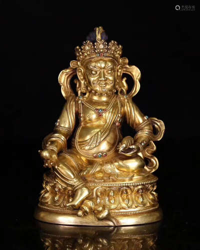 A BRONZE GLITED WEALTH OF GOD FIGURE