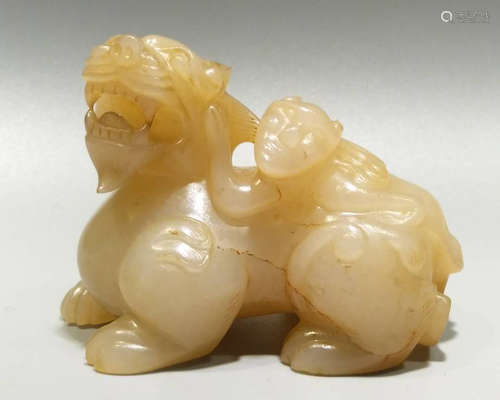 A FINE CARVED MONSTER JADE