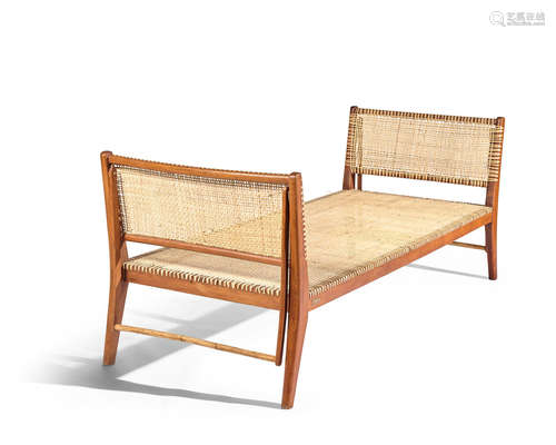 Rare Daybeddesigned 1939, executed 2004for the Golconde Collection, with articulated handles, teak, cane, brass label 'Golconde Collection: Bcd No.1-Date 08/2004 Designed by George Nakashima' height 33 3/4in (85cm); width 85in (216cm); depth 34in (86cm)  George Nakashima (1905-1990)