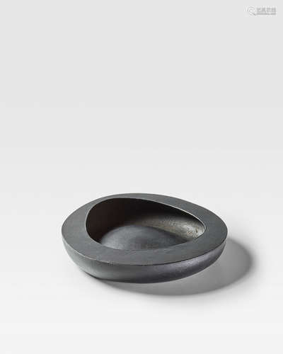 Bowlcirca 1950for Ooi Kojo/Bonniers, cast iron, cast mark 'Bonniers Japan'height 1 4/8in (3.5cm); width 7 3/4in (19.5cm); depth 7 3/8in (18.5cm)  Isamu Noguchi (1904-1988); Attributed to