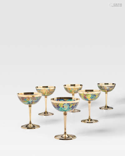 Set of Six Wine Gobletscirca 1950 plique-à-jour enamel, silver gilt, each depicting various birds including a bird of paradise, a parrot, a cockerel, a dove, a duck and a pheasant, stamped 'Masriera y Carreras', Spanish hallmarks height 5 5/8in (14.3cm); diameter 4 1/8in (10.5cm)  Masriera y Carreras (Founded 1915)