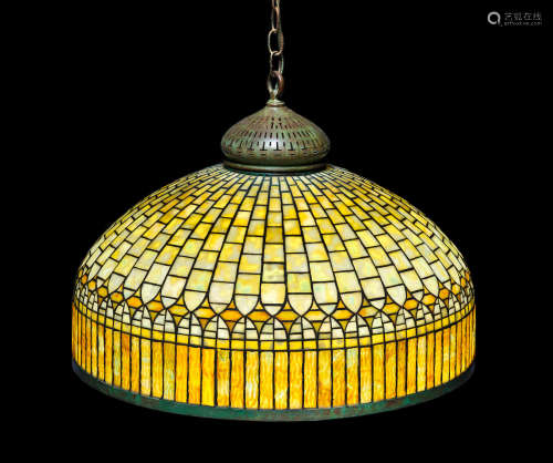 Curtain Border Shadecirca 1910mounted as a chandelier, leaded glass, patinated bronze, stamped 'TIFFANY STUDIOS NEW YORK'height 18 1/2in (47cm); 24 1/2in (62cm)  Tiffany Studios (1899-1919)