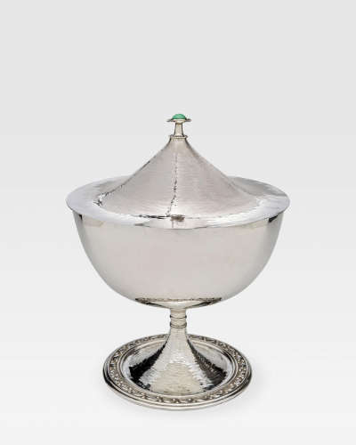 Large Soup Tureen and Covercirca 1905electro-plated nickel on cast base, decorated with a band of chased leaves and the cover surmounted by a chalcedony cabochon set in a silver flowerLiteratureC.R. Ashbee 'Modern English Silverwork', B. Weinreb, 1974, pl.55  Charles R. Ashbee (1863-1942)