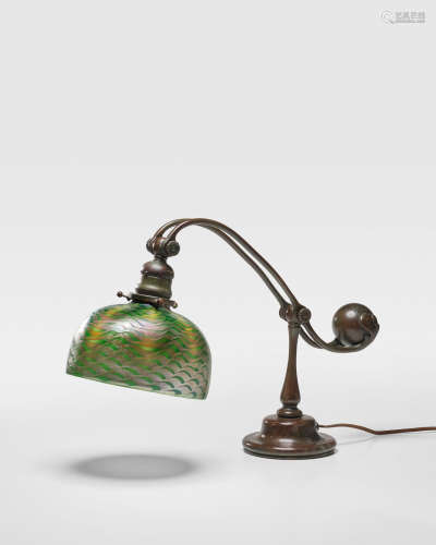Counter Balance Desk Lampcirca 1910patinated bronze, cased and iridescent glass damascene shade, stamped 'Tiffany Studios New York'height 18in (45cm); width 24 1/2in (62cm)  Tiffany Studios (1899-1919)