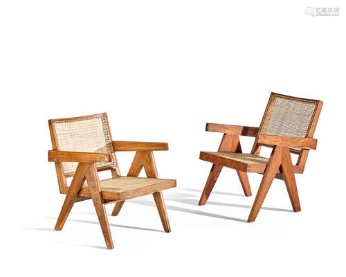 Two Easy Armchairscirca 1955-56teak, cane, upholstered cushionsheight 30in (76cm); width 25 1/2in (65cm); depth 20 1/2in (52cm) and height 27in (69cm); width 25 1/2in (65cm); depth 20in (51cm)  Pierre Jeanneret (1896-1967)