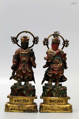 Two Japanese carved wood guardians.