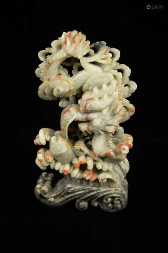 A Chinese Soft Stone Carved Fish to Dragon Figurine