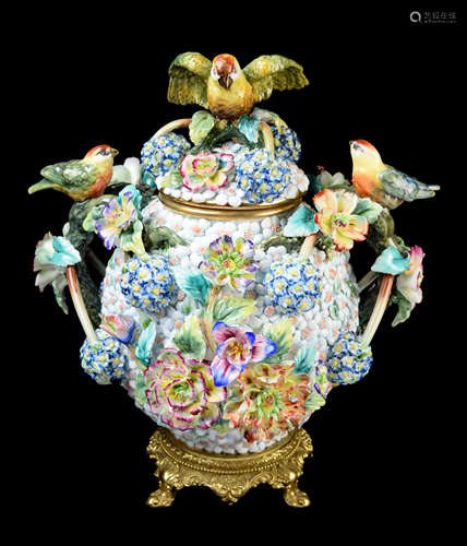 A Continental Porcelain Lided Urn with Flowers and Birds