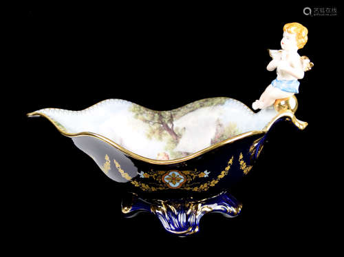 A Continental Cobalt Blue Porcelain Boat Shape Compote with Cherub and Painting
