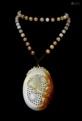 A Exquisitely Carved Hollowout Agate Pendant with Patterns of Longevity, Fortune, and Prosperity