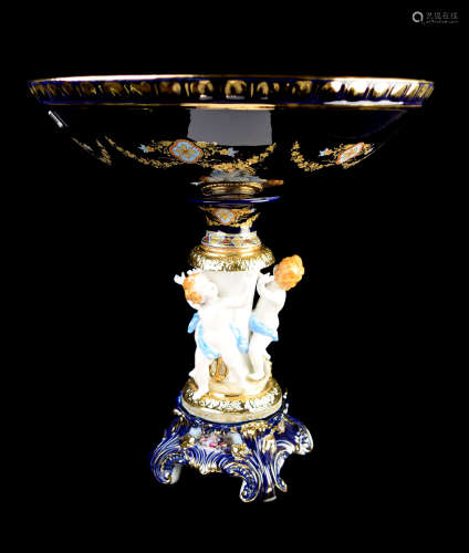A Continental Cobalt Blue Porcelain Compote with Three Cherubs and Painting