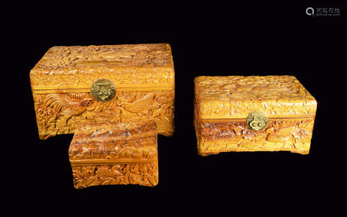 A Set of Three Camphor Wood Jewelry Boxes with Relief of Flowers and Birds
