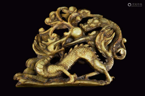 A 19th Century Chinese White Jade Carved Dual Dragons with Ball Ornament