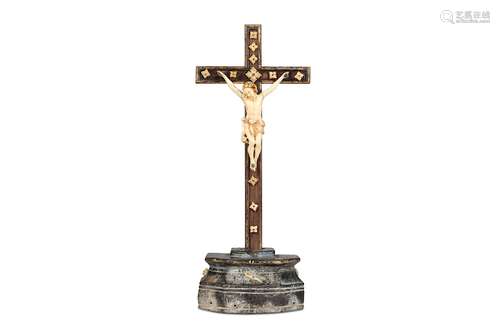 AN 18TH CENTURY INDO-PORTUGUESE (GOAN) IVORY AND CARVED WOOD CRUCIFIX the ivory figure of Christ with finely carved hair