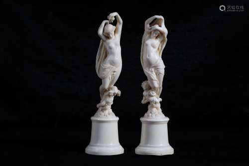 A PAIR OF 19TH CENTURY FRENCH DIEPPE IVORY ALLEGORICAL FIGURES OF DAY AND NIGHTthe figure of Day unveiling herself